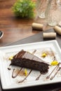 Chocolate cake with shinny chocolate ganache frosting on blurred background Royalty Free Stock Photo