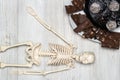 Chocolate cake and slices on a plate and skeleton. Concept of death from diabetes.