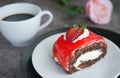 Chocolate cake with strawberry jam sauce topped with whipped cream and fresh strawberry chopped served on white plate Royalty Free Stock Photo