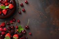 a chocolate cake surrounded by berries on a plate and cup of tea Royalty Free Stock Photo