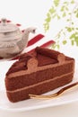 Chocolate cake with tea pot Royalty Free Stock Photo