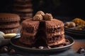 a chocolate cake with two pieces cut out of it and chocolate chips on the side of the cake and a plate of cookies in the