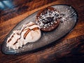 Chocolate cake with vanila icecream in a fancy plate