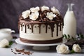 Chocolate cake with white roses and milk on a gray background