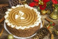 Chocolate cake on wooden table near Christmas decoration Royalty Free Stock Photo