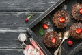 Chocolate cakes with cream and strawberries on a black wooden rustic background. The view from the top,flat lay. Royalty Free Stock Photo