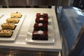 chocolate cakes or sugary desserts in display case