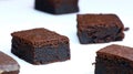 Chocolate cakes: very black chocolate brownies on a white plate