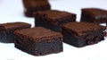 Chocolate cakes: very black chocolate brownies on a white plate