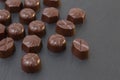 chocolate candies on a black background. dark photo
