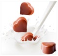Chocolate candies falling into the milky splash. Royalty Free Stock Photo