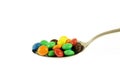 Chocolate candies in the spoon isolated Royalty Free Stock Photo