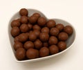 Chocolate Candy in Heart Shaped Bowl Royalty Free Stock Photo