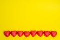 Chocolate Candy Red Heart Sweets for Valentine\'s Day on yellow background.Copy space