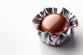 Chocolate candy in a silver wrapper. Space for text. Royalty Free Stock Photo