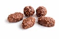 Chocolate sweet candy truffle with hazelnut nut crumble on isolated white background. Royalty Free Stock Photo