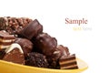 Chocolate candy on yellow plate Royalty Free Stock Photo