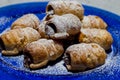 Chocolate cannoli. Italian chocolate sweets on blue plate and white background Royalty Free Stock Photo