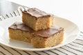 Chocolate caramel rice crispy treats on a white plate. Royalty Free Stock Photo