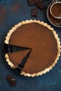 Chocolate and caramel tart on dark blue background Royalty Free Stock Photo