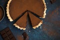 Chocolate and caramel tart on dark blue background Royalty Free Stock Photo