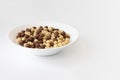 Chocolate cereal in bowl isolated on white background Royalty Free Stock Photo