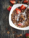 Chocolate cereals and strawberries for breakfast Royalty Free Stock Photo