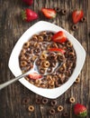 Chocolate cereals and strawberries for breakfast closeup. Royalty Free Stock Photo