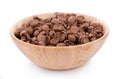 Chocolate cereals in wooden bowl on white background. Cornflakes Royalty Free Stock Photo