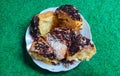 Chocolate and cheese flavored bread on plate on green rug background Royalty Free Stock Photo