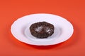 Chocolate cheese pie on a plate on a red background Royalty Free Stock Photo