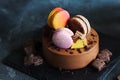 Chocolate cheesecake with banana filling decorated with macarons and toffee Royalty Free Stock Photo