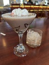 Chocolate cherry martini with whipped cream and side of rocks glass of ice Royalty Free Stock Photo