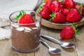 Chocolate chia seed pudding with almond slices and strawberry Royalty Free Stock Photo