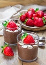 Chocolate chia seed pudding with almond slices and strawberry Royalty Free Stock Photo