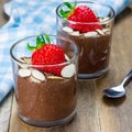 Chocolate chia seed pudding garnished with almond slices and strawberry, square format Royalty Free Stock Photo