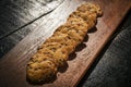 Chocolate chip cookie biscuits on wooden board