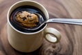Chocolate Chip Cookie in the Coffee with Spoon. Royalty Free Stock Photo