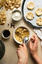 Chocolate chip cookie cooking process. Female hand holdin ice cream scoop spoon Royalty Free Stock Photo