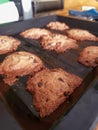 Chocolate Chip Cookies on a baking pan fresh out of the oven with crumbs Royalty Free Stock Photo