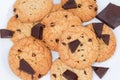 Chocolate chip cookies and broken chocolate pieces on white background Royalty Free Stock Photo