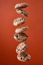 Chocolate chip cookies falling in stack Royalty Free Stock Photo