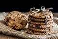 Chocolate chip cookies freshly baked on sackcloth on wooden table background. Homemade pastry. With copy space for text and logo. Royalty Free Stock Photo