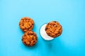 Chocolate chip cookies with a glass of milk on a light blue back Royalty Free Stock Photo