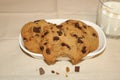 Chocolate Chip Cookies and Glass of Milk on Table Royalty Free Stock Photo