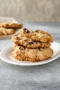 Chocolate chip cookies on linen napkin on gray table. Stacked chocolate chip cookies close up. Royalty Free Stock Photo