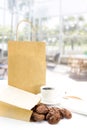 Chocolate chip cookies in paper bag and cup coffee with notebook Royalty Free Stock Photo