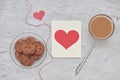 Chocolate chip cookies on plate and glass of milk coffee with love message card on white stone background Royalty Free Stock Photo