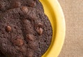 Chocolate chip crispy brownie cookies on yellow plate Royalty Free Stock Photo