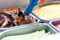 Chocolate chip ice cream being scooped. Surrounded by other flavours Royalty Free Stock Photo